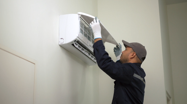 Technician Checking Air Conditioner – Expert AC Inspection Services in Dubai